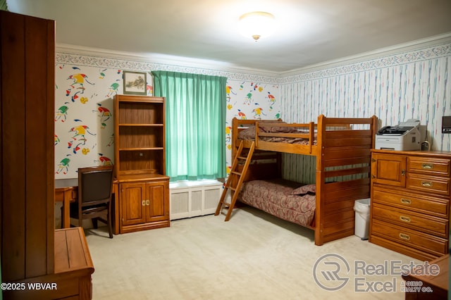 bedroom featuring crown molding and light colored carpet