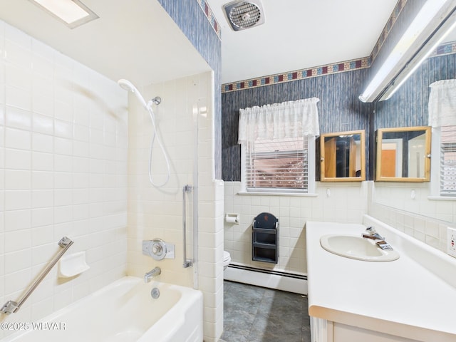 bathroom with a baseboard heating unit, vanity, tile walls, shower / washtub combination, and wallpapered walls