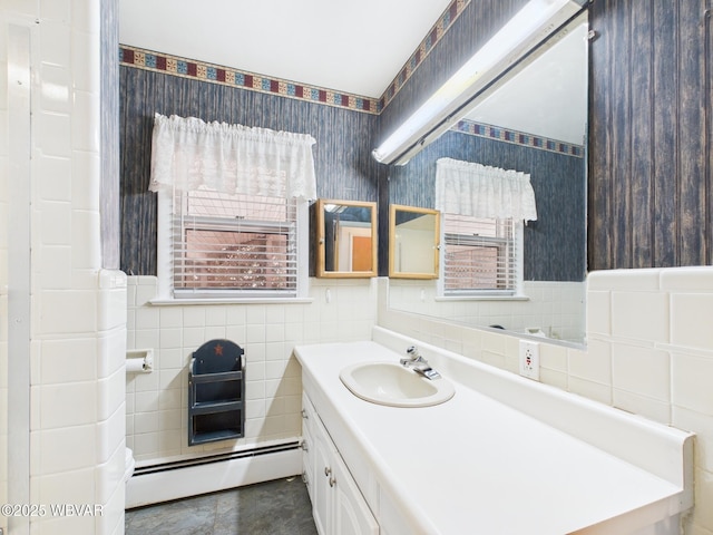 bathroom with wallpapered walls, a baseboard heating unit, tile walls, and vanity