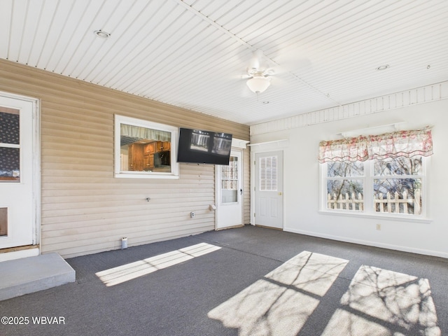 interior space with plenty of natural light and a ceiling fan