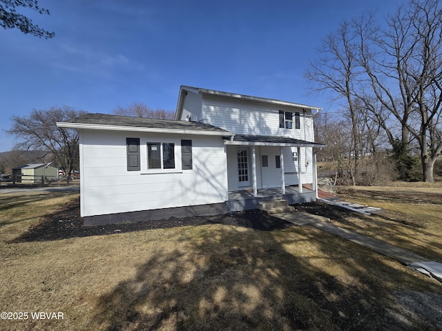 387 Davidson Rd, Jersey Shore, PA 17740 - view of front of home with a porch, a shingled roof, and a front lawn