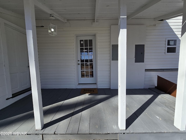 view of exterior entry featuring electric panel