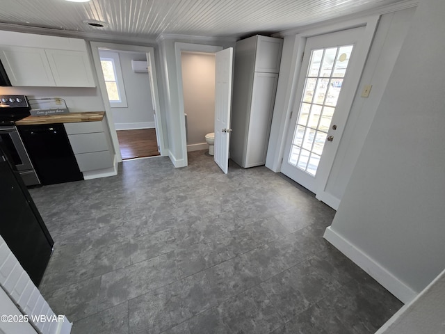 kitchen with wood ceiling, white cabinets, wood counters, and electric stove