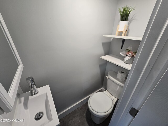 387 Davidson Rd, Jersey Shore, PA 17740 - bathroom featuring toilet, baseboards, and a sink