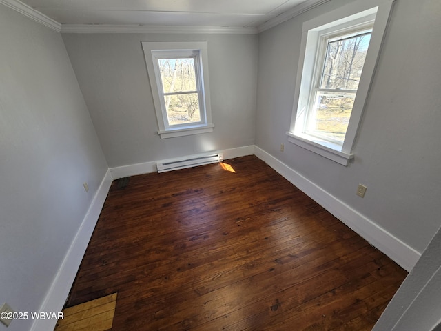 unfurnished room featuring baseboard heating, crown molding, and dark wood-type flooring