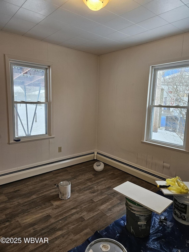 unfurnished room with dark wood-type flooring