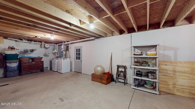 unfinished below grade area featuring washer and clothes dryer