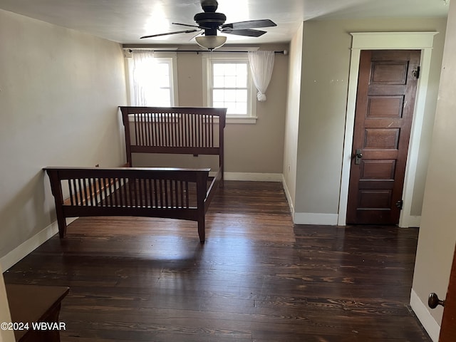 unfurnished bedroom with dark hardwood / wood-style flooring