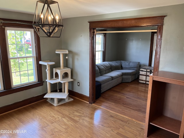 living room featuring hardwood / wood-style floors and a chandelier