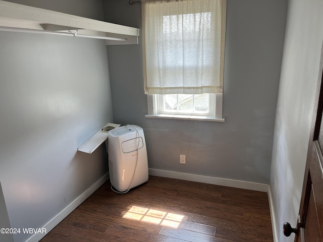 laundry room featuring dark wood-type flooring