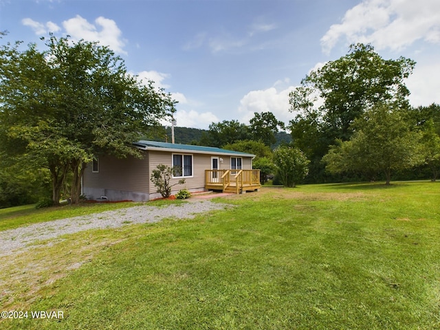 view of yard with a wooden deck