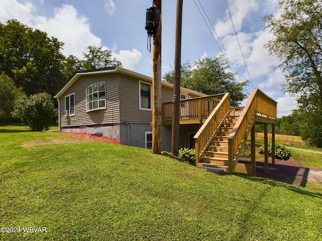 view of side of property featuring a deck and a lawn