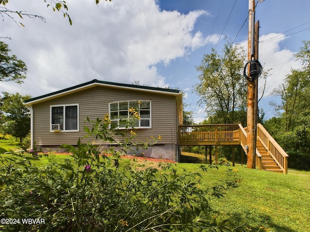 rear view of house with a wooden deck