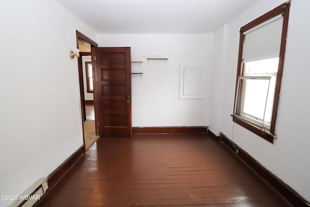 hall with dark hardwood / wood-style flooring