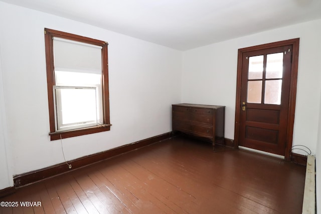 empty room featuring dark hardwood / wood-style floors