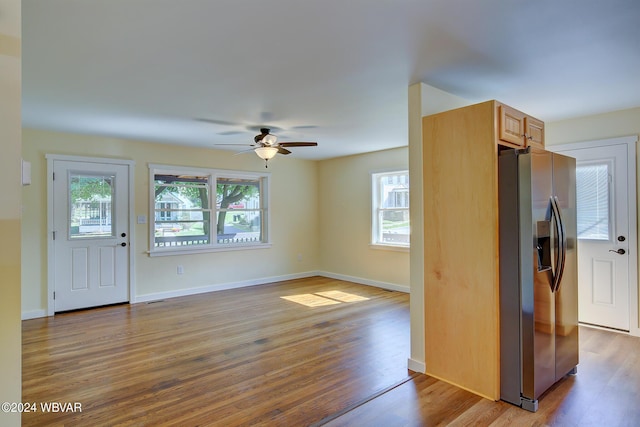 interior space featuring a wealth of natural light, light hardwood / wood-style flooring, and ceiling fan