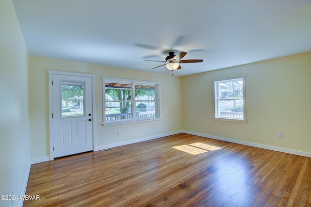 unfurnished room with ceiling fan and light hardwood / wood-style flooring