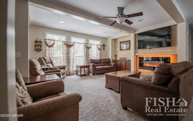 living room featuring ceiling fan, light colored carpet, and beam ceiling