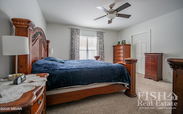 carpeted bedroom with ceiling fan