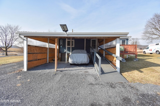 view of front of house featuring a carport and driveway