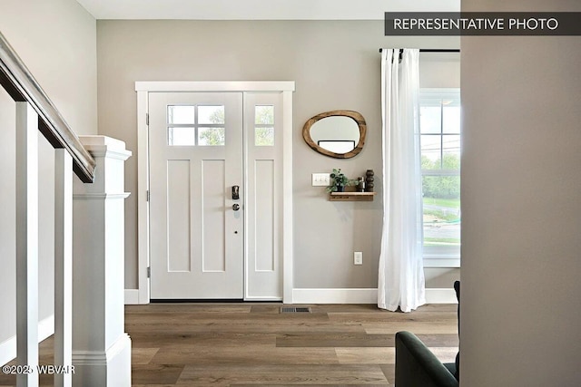 2287 Warrensville Rd, Montoursville, PA 17754 - entryway featuring healthy amount of natural light, wood finished floors, and baseboards