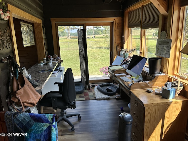 office area featuring wood walls