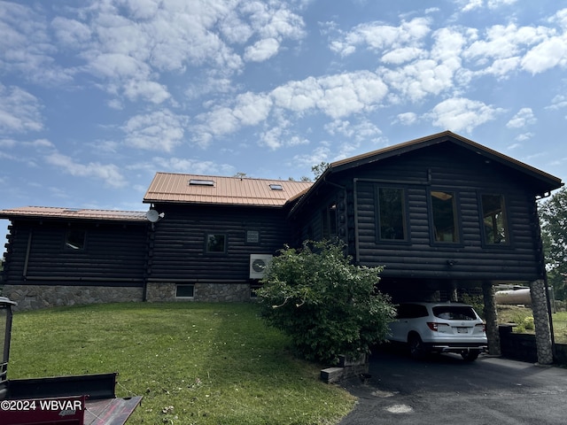 exterior space featuring a lawn and a carport