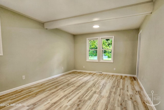 294 Park Ave, Lock Haven, PA 17745 - empty room with wood finished floors, baseboards, and beam ceiling