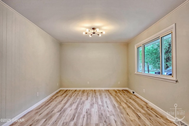 294 Park Ave, Lock Haven, PA 17745 - unfurnished room featuring wood finished floors, a chandelier, crown molding, and baseboards