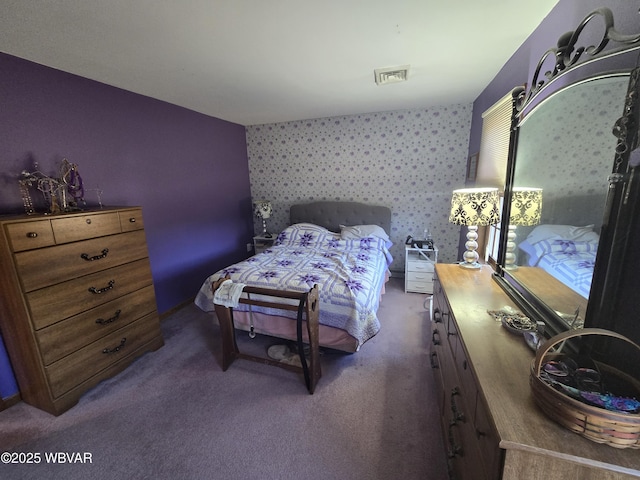 bedroom with visible vents, carpet, and wallpapered walls