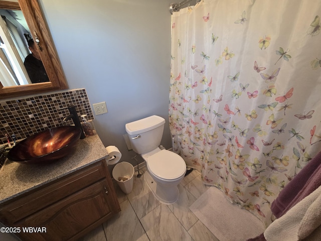 full bathroom with tasteful backsplash, toilet, vanity, and a shower with shower curtain