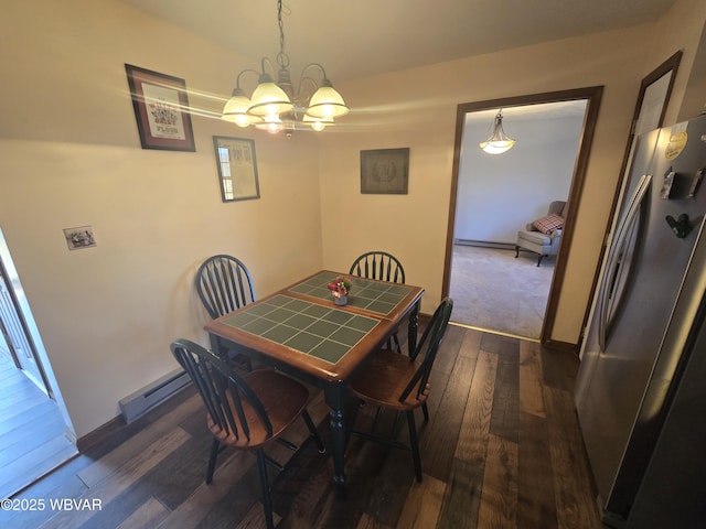 dining room featuring a baseboard radiator, baseboards, dark wood-type flooring, and a chandelier