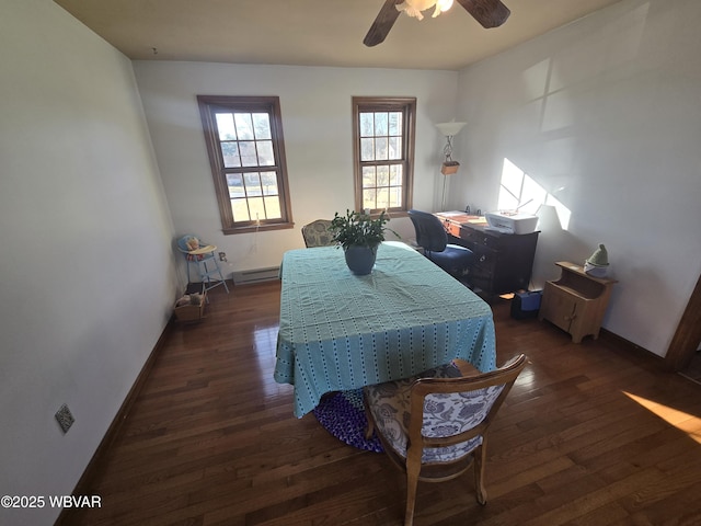 bedroom featuring ceiling fan, a baseboard heating unit, dark wood-type flooring, and baseboards