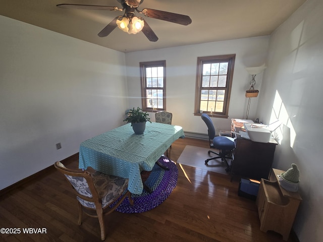 dining area with wood finished floors, baseboards, and ceiling fan