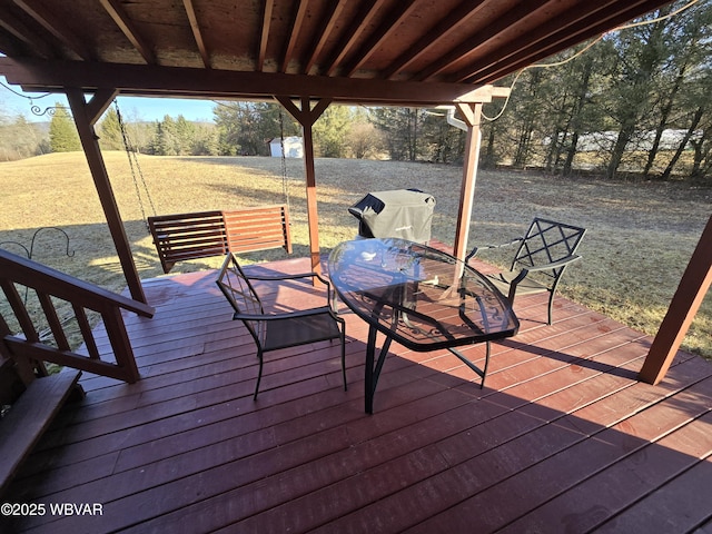 deck with outdoor dining area