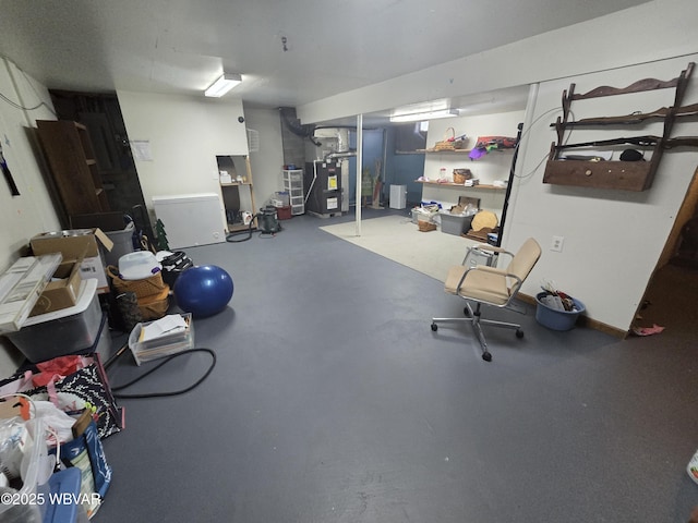 finished basement featuring heating unit