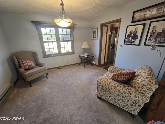 sitting room featuring baseboards, carpet flooring, baseboard heating, and visible vents