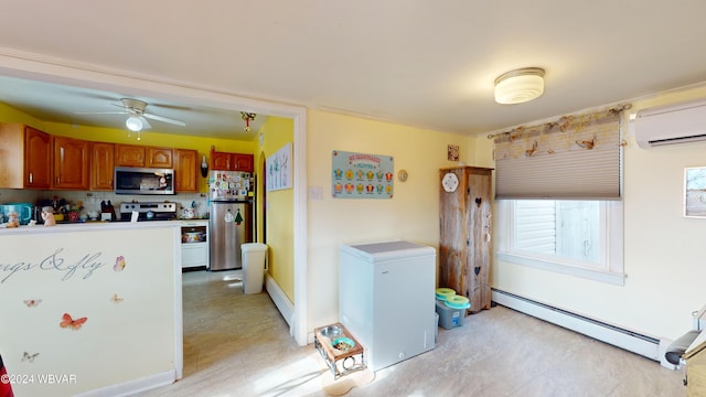 kitchen featuring stainless steel appliances, an AC wall unit, baseboard heating, and ceiling fan