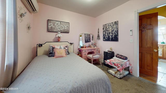 bedroom with a wall unit AC