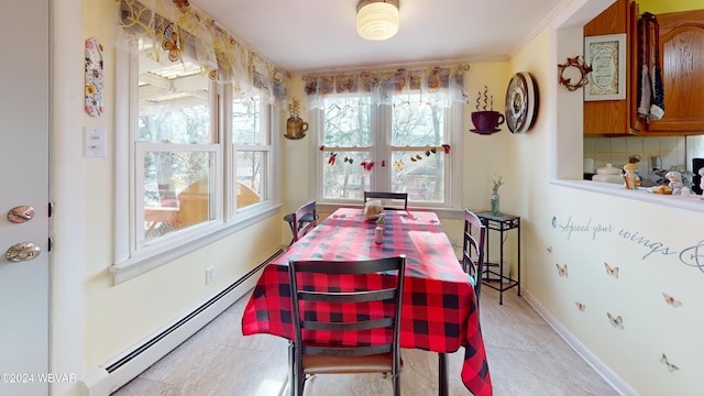 dining room featuring crown molding and a baseboard radiator