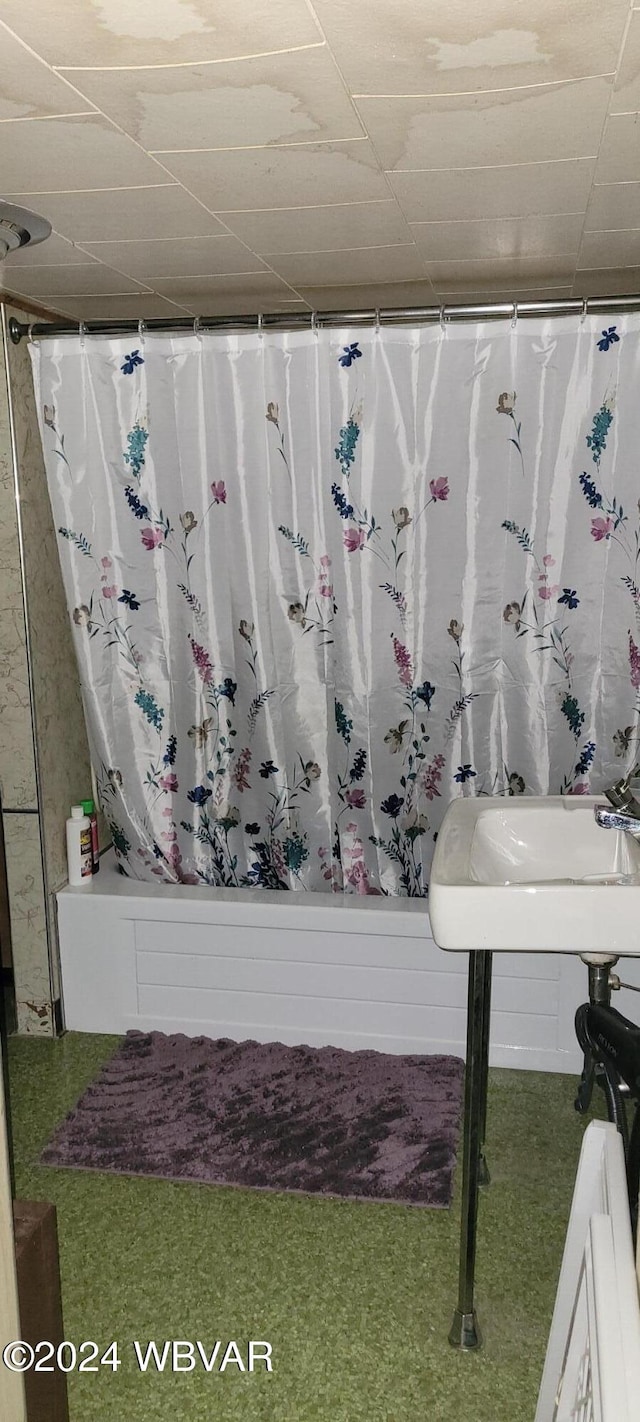 bathroom with shower / bath combination with curtain