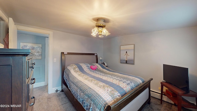 carpeted bedroom featuring a baseboard radiator