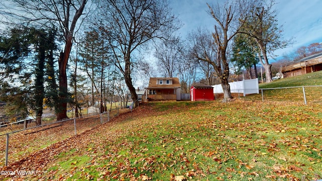 view of yard featuring a storage shed