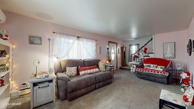 living room featuring a wall mounted air conditioner and carpet floors