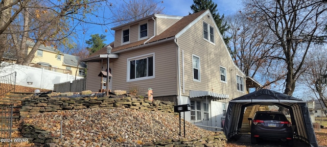 view of side of home with a gazebo