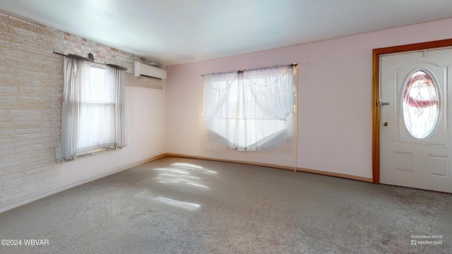 carpeted entrance foyer featuring a wall mounted air conditioner