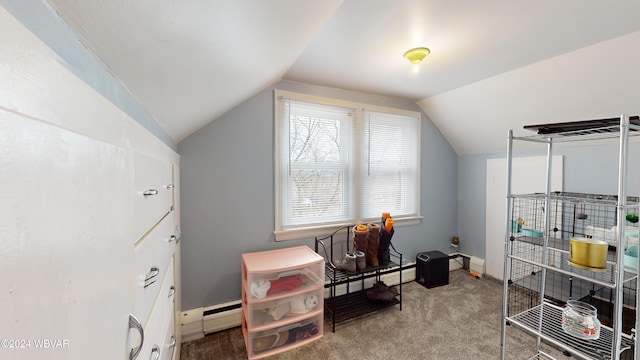 interior space featuring carpet, a baseboard radiator, and vaulted ceiling