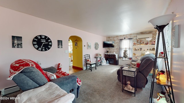 living room featuring carpet, a wall unit AC, baseboard heating, and brick wall