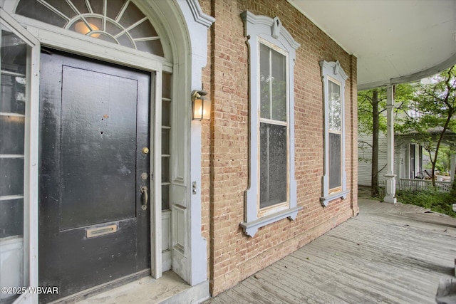 330 High St, Williamsport, PA 17701 - doorway to property featuring brick siding and a porch