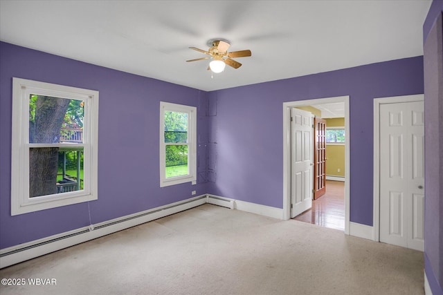 330 High St, Williamsport, PA 17701 - empty room featuring a baseboard heating unit, ceiling fan, baseboards, and a baseboard radiator